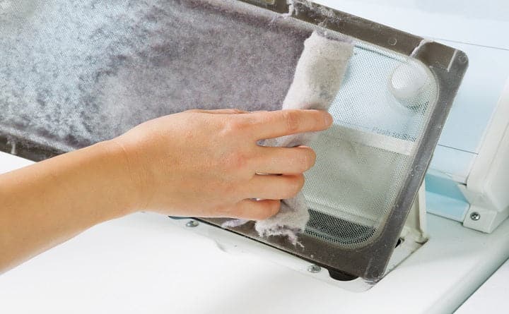 commercial dryer vent cleaning experts on the job